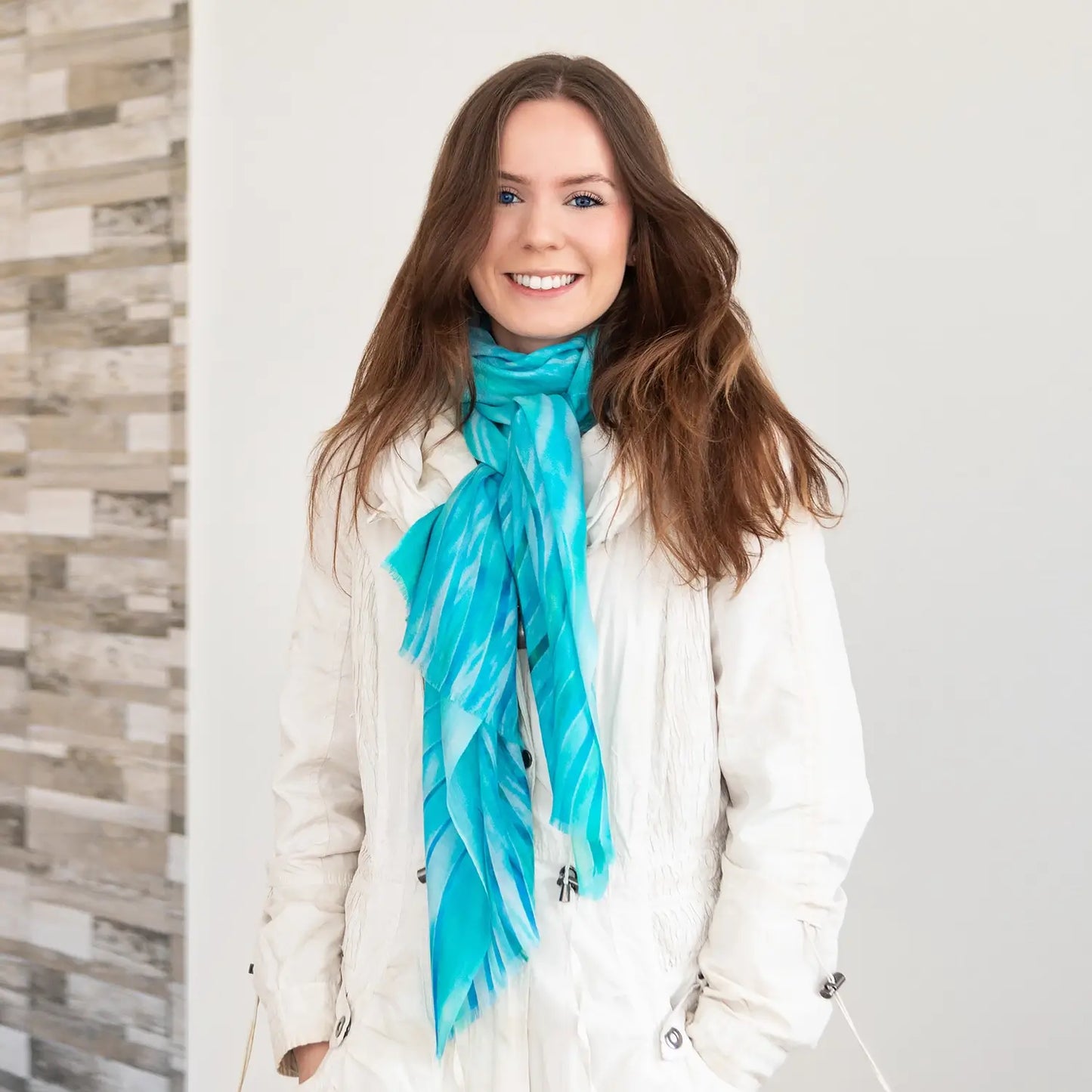 aqua florida cashmere wool scarf by seahorse silks with white winter coat
