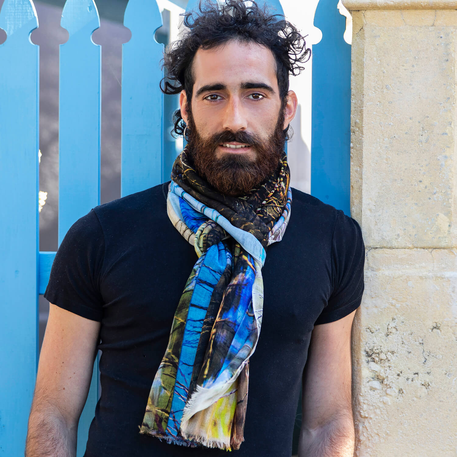 man wearing the dam cashmere wool scarf by seahorse silks