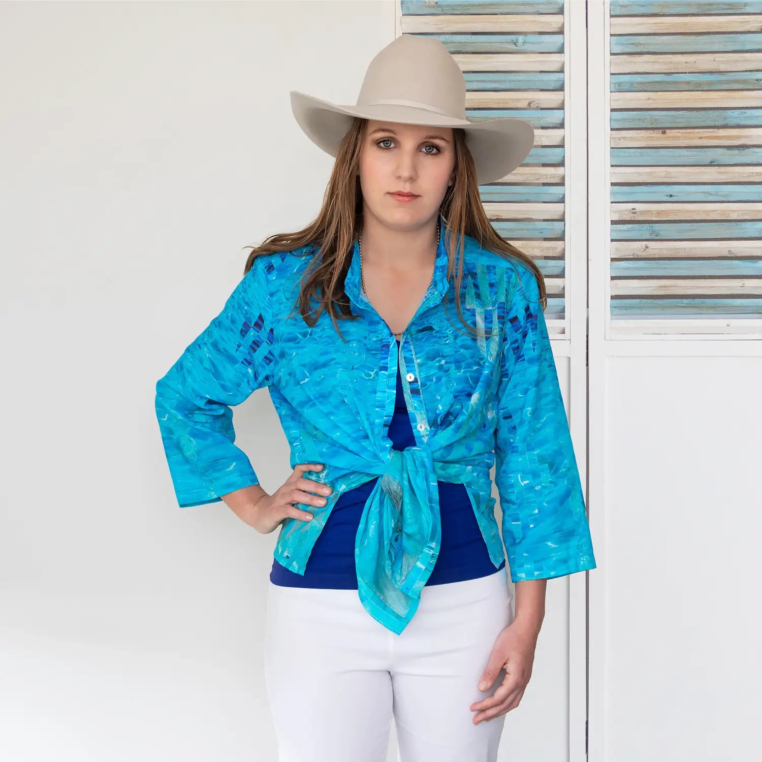 clear blue silk cotton shirt tied in front over blue singlet by seahorse silks