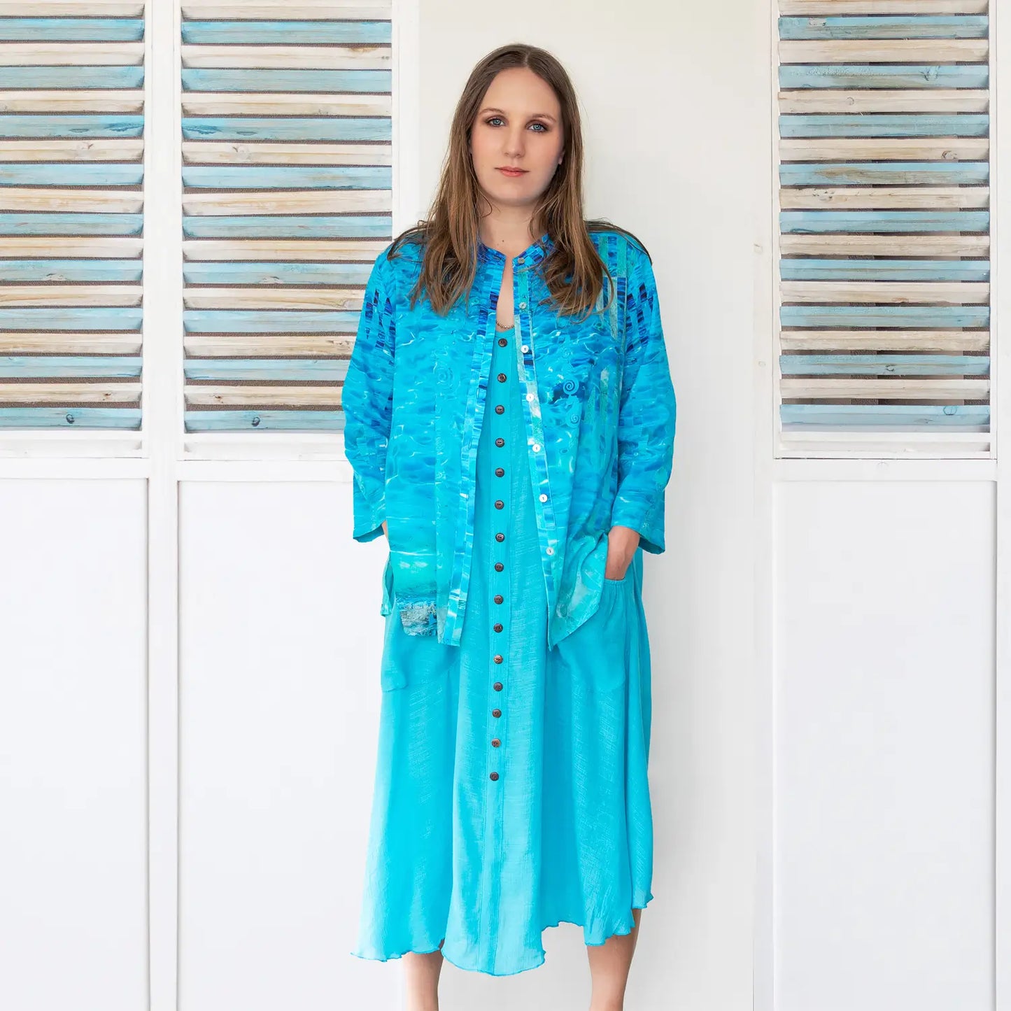 clear blue cotton silk shirt worn open over blue dress by seahorse silks
