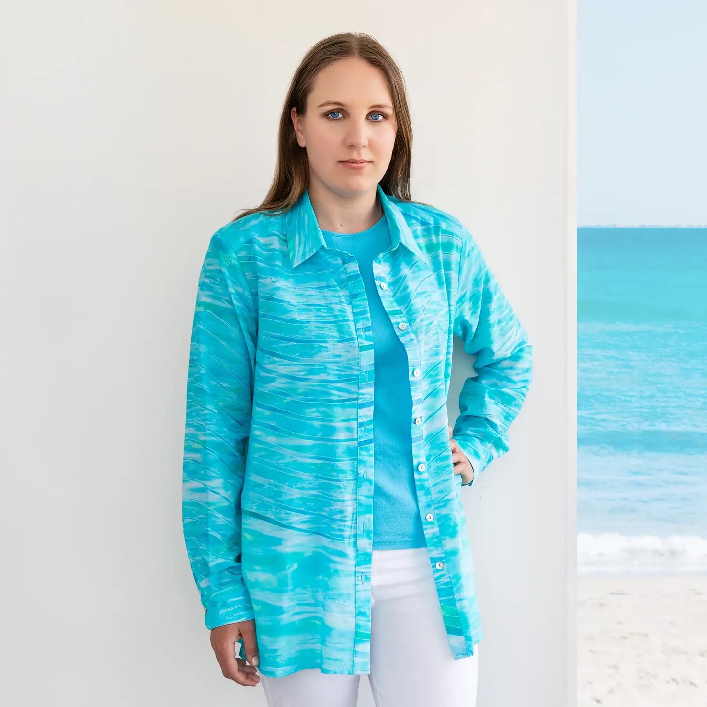 florida silk cotton long sleeve shirt worn open over aqua blue top and white pants