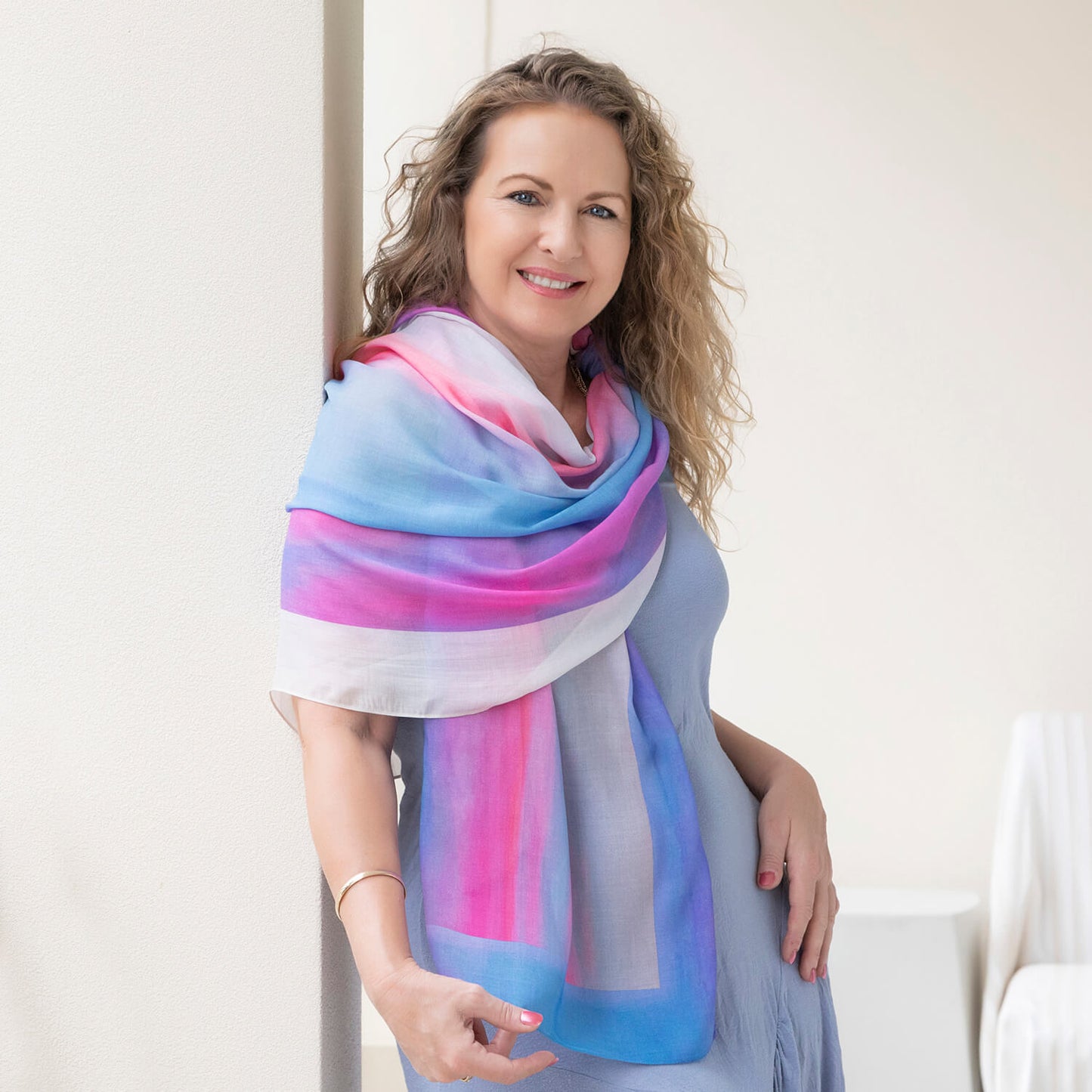 g & t time pink & blue scarf worn as wrap over blue dress by seahorse silks