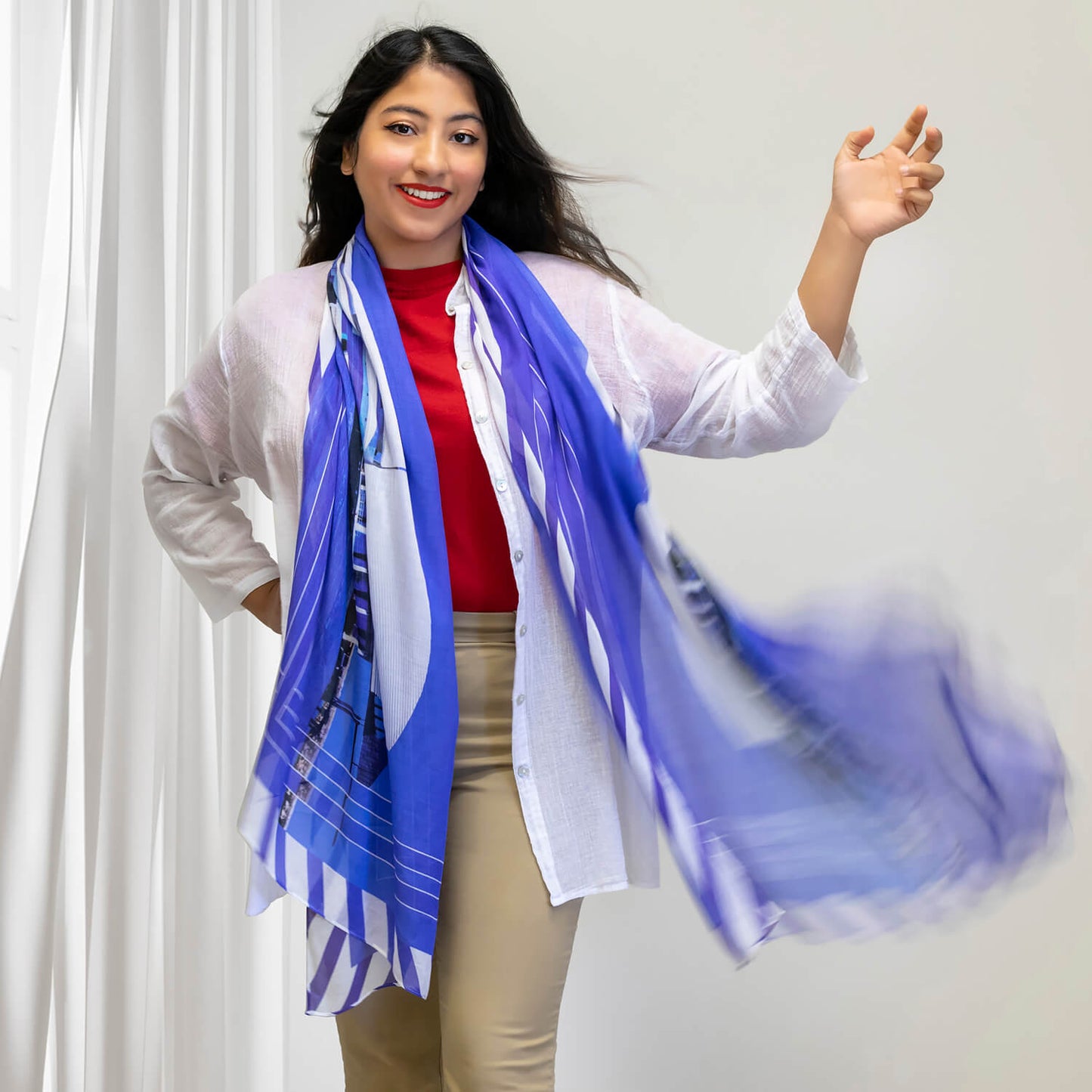 maritime blue and white scarf by seahorse silks worn with red top and white shirt